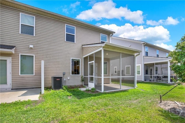132 Congo Ct, Pooler, GA 31322 - rear view of house with a sunroom, central AC unit, a patio, and a lawn