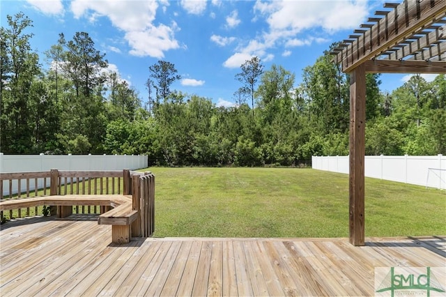 deck with a lawn and fence