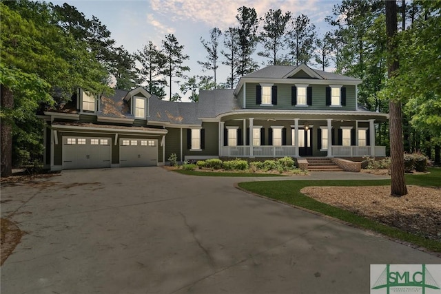 80 Hickory St, Richmond Hill, GA 31324 - view of front of home featuring an attached garage, covered porch, and driveway