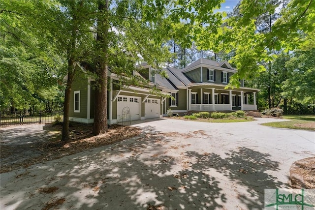 80 Hickory St, Richmond Hill, GA 31324 - view of front of house with fence, driveway, and a garage