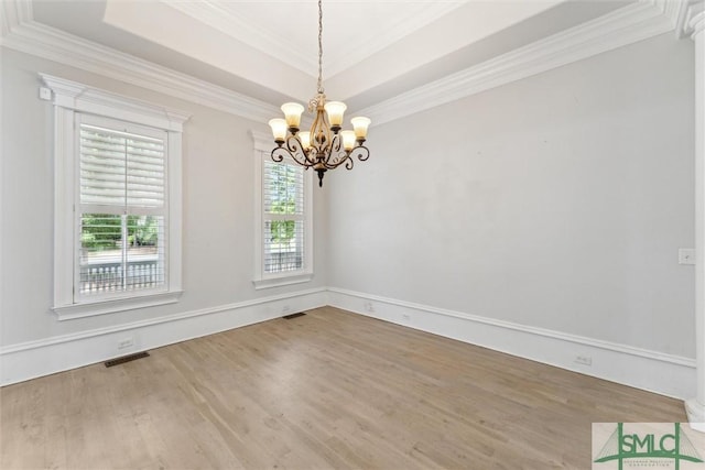 80 Hickory St, Richmond Hill, GA 31324 - spare room with an inviting chandelier, crown molding, visible vents, wood finished floors, and a tray ceiling