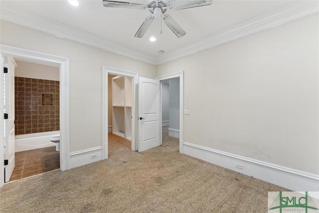 80 Hickory St, Richmond Hill, GA 31324 - unfurnished bedroom with carpet floors, ornamental molding, a walk in closet, and a closet