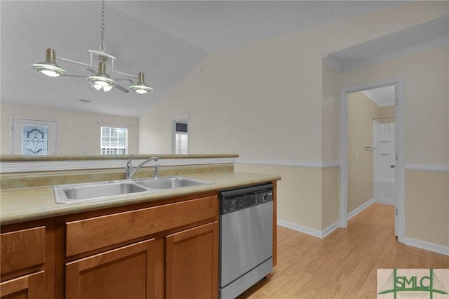 kitchen with a sink, dishwasher, brown cabinetry, light wood-type flooring, and vaulted ceiling