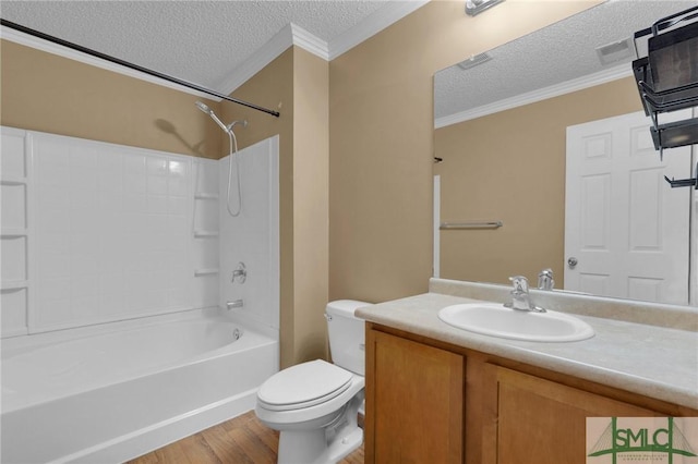 full bathroom featuring crown molding, vanity, toilet, a textured ceiling, and wood finished floors