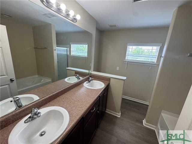 67 Chapel Lk N, Savannah, GA 31419 - bathroom with visible vents, a sink, and wood finished floors