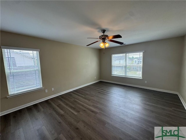 unfurnished room featuring dark wood-type flooring, baseboards, and ceiling fan