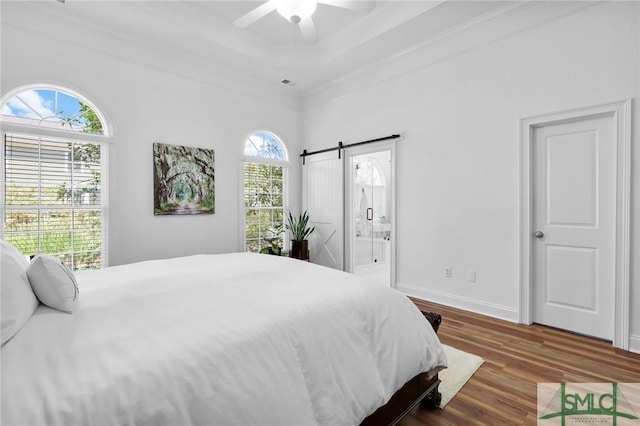 5 Lazy Hammock Ct, Savannah, GA 31419 - bedroom with ceiling fan, crown molding, a barn door, wood finished floors, and a raised ceiling