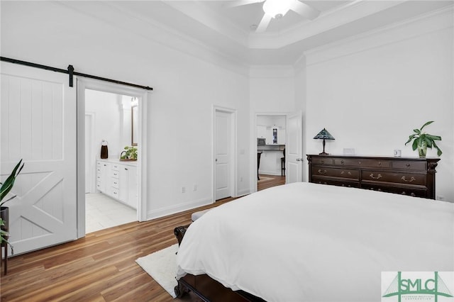 5 Lazy Hammock Ct, Savannah, GA 31419 - bedroom with crown molding, wood finished floors, ceiling fan, a barn door, and connected bathroom