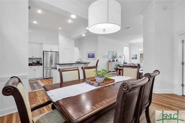 5 Lazy Hammock Ct, Savannah, GA 31419 - dining area featuring light wood-type flooring, recessed lighting, baseboards, and ornamental molding