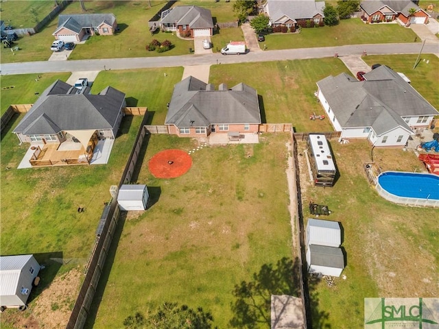 birds eye view of property with a residential view