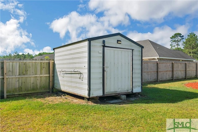 view of shed featuring a fenced backyard