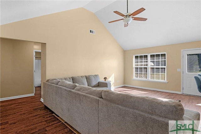 living area featuring visible vents, baseboards, high vaulted ceiling, dark wood-type flooring, and a ceiling fan