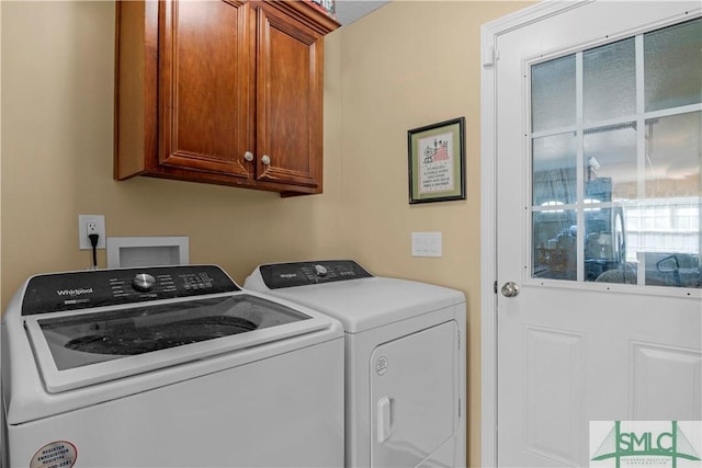 laundry area featuring cabinet space and washing machine and clothes dryer