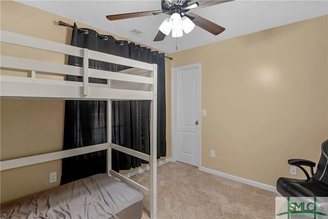 unfurnished bedroom with carpet floors, baseboards, ceiling fan, and visible vents