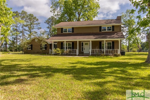 view of front facade featuring central air condition unit, covered porch, and a front lawn
