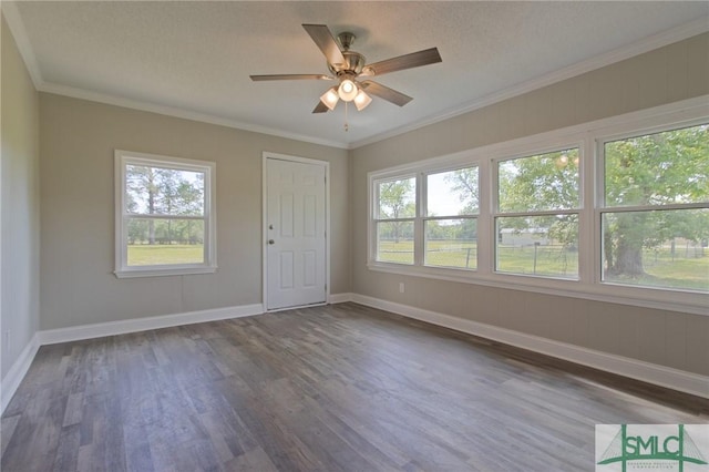 unfurnished room with baseboards, plenty of natural light, dark wood-style floors, and ceiling fan