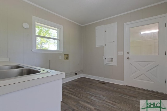 laundry area with crown molding, baseboards, dark wood finished floors, cabinet space, and washer hookup