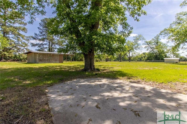 view of yard with fence and a patio area