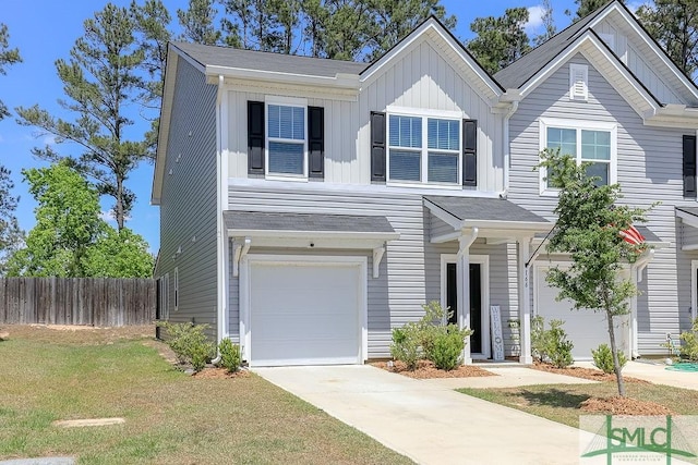 166 Benelli Dr, Pooler, GA 31322 - view of front facade featuring an attached garage, a front lawn, board and batten siding, and fence