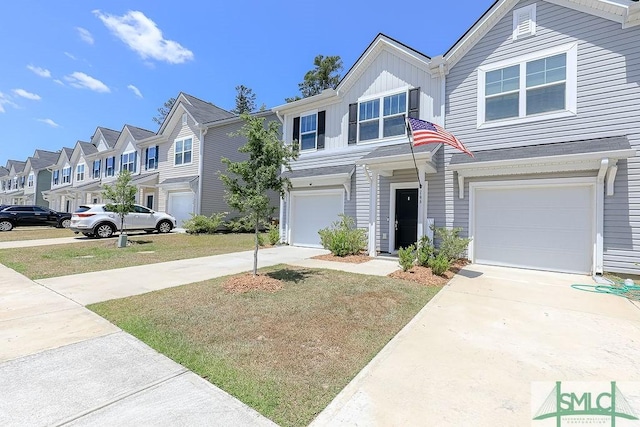166 Benelli Dr, Pooler, GA 31322 - view of front of house featuring a garage, board and batten siding, driveway, and a residential view