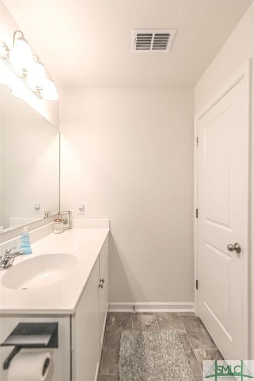 166 Benelli Dr, Pooler, GA 31322 - bathroom with baseboards, visible vents, and vanity