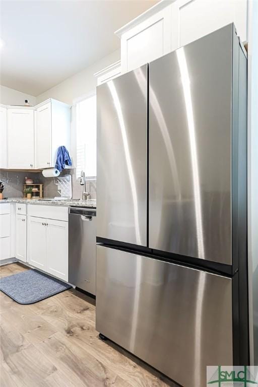 166 Benelli Dr, Pooler, GA 31322 - kitchen featuring light wood-style floors, white cabinetry, and stainless steel appliances
