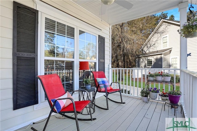 deck featuring a porch and ceiling fan