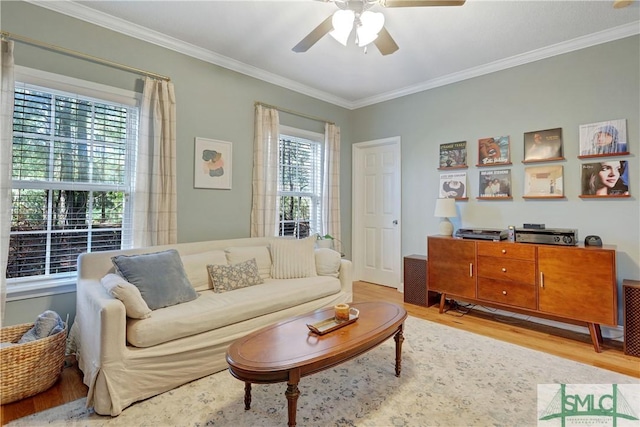 living room featuring a ceiling fan, wood finished floors, and ornamental molding