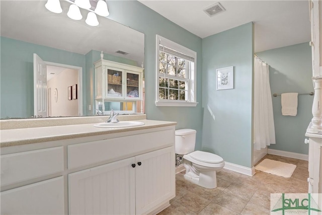 full bathroom with visible vents, a shower with shower curtain, toilet, and vanity