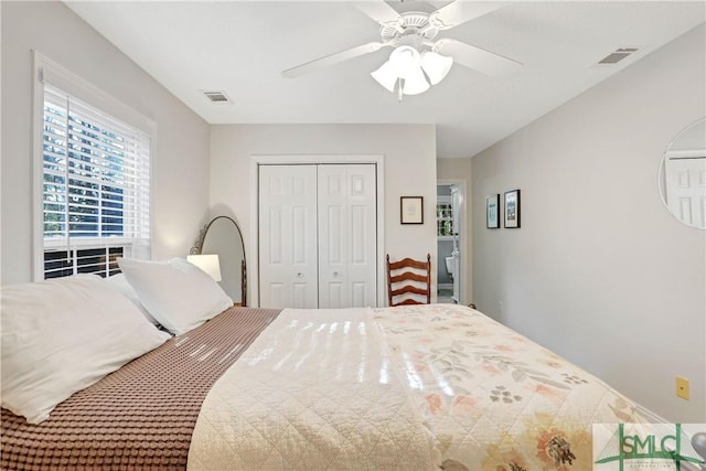 bedroom featuring a ceiling fan, visible vents, and a closet