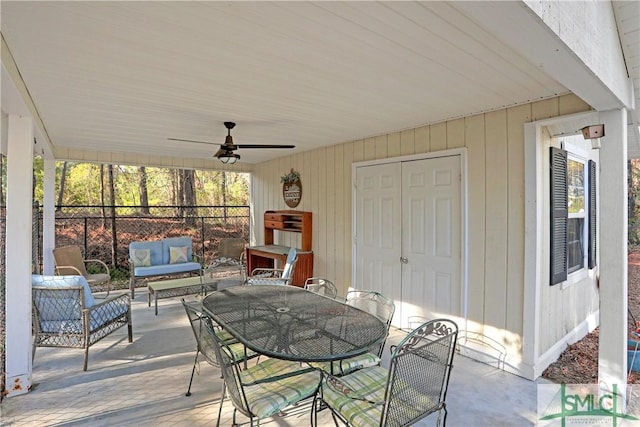view of patio with a ceiling fan, outdoor dining area, and an outdoor living space