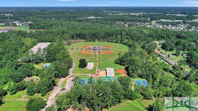 drone / aerial view with a view of trees