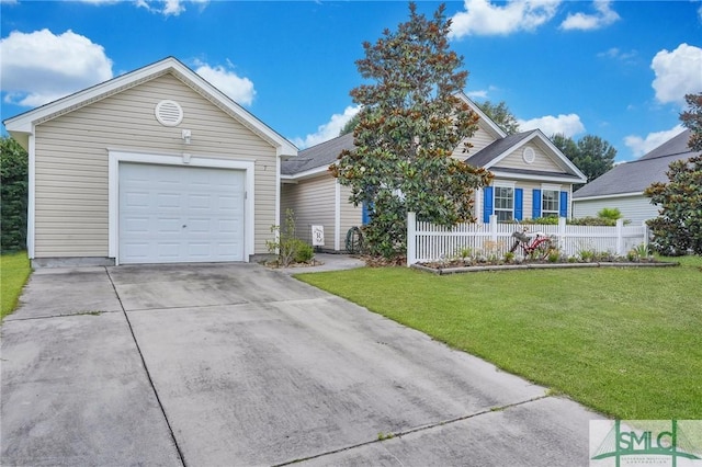 view of front of home with an attached garage, fence, a front yard, and concrete driveway