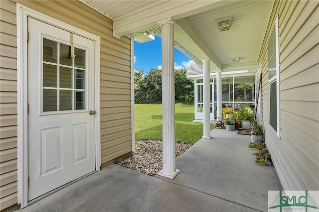 view of patio / terrace featuring a sunroom