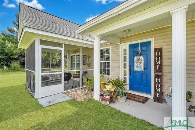 property entrance with a shingled roof and a yard