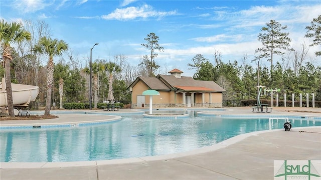 community pool featuring a patio area