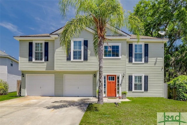 view of front of property featuring a garage, driveway, and a front lawn