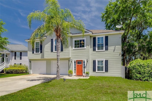 view of front of house featuring an attached garage, a front lawn, and driveway