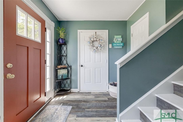 entryway with stairs and wood finished floors