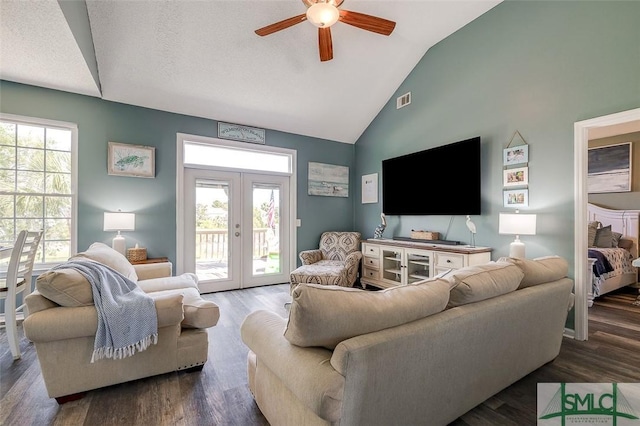 living area with ceiling fan, high vaulted ceiling, french doors, wood finished floors, and visible vents