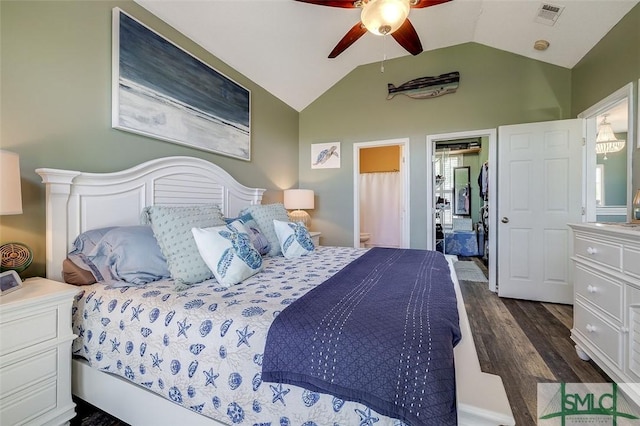 bedroom featuring a ceiling fan, connected bathroom, visible vents, dark wood-style floors, and lofted ceiling