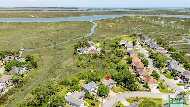 drone / aerial view featuring a residential view and a water view
