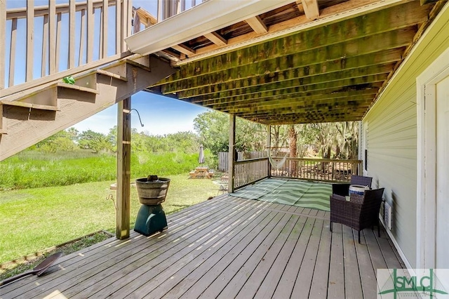 wooden deck with a yard