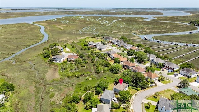 birds eye view of property featuring a water view and a residential view