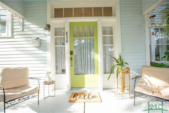 entrance to property featuring covered porch