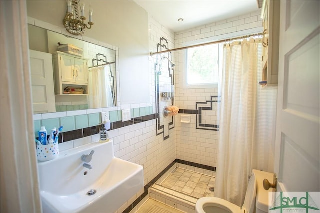 bathroom featuring toilet, tile walls, and a tile shower