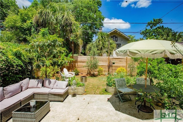 view of patio featuring fence and an outdoor living space