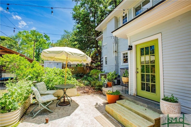 view of patio / terrace featuring fence and entry steps