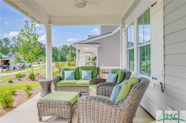 view of patio with outdoor lounge area and a ceiling fan