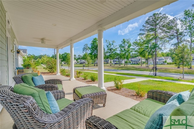 view of patio / terrace featuring an outdoor hangout area, covered porch, and a residential view